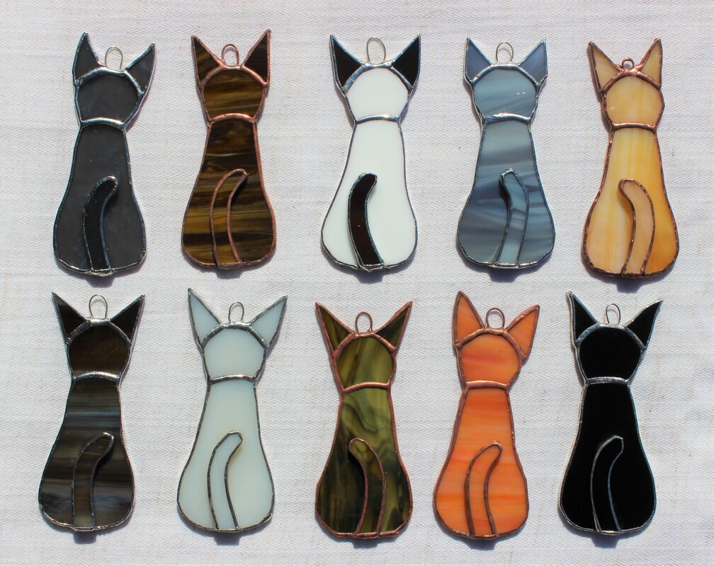 Group of 10 cat ornaments
