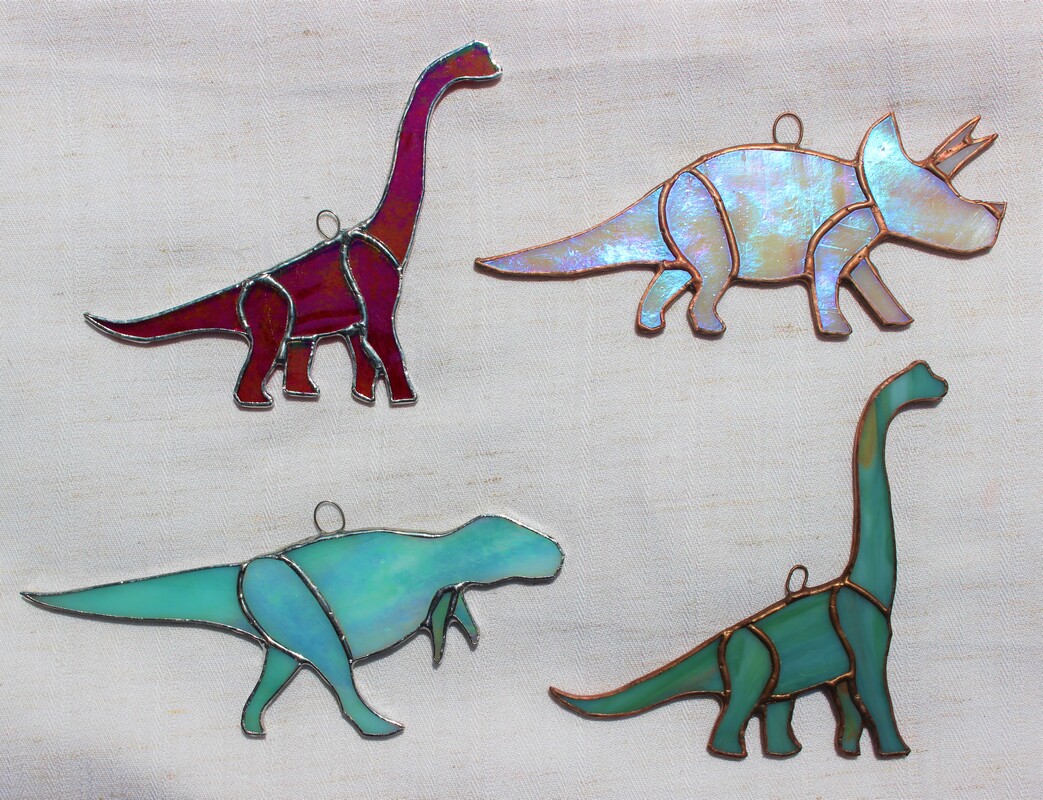 dinosaurs: brachiosaurus, triceratops, and T. rex