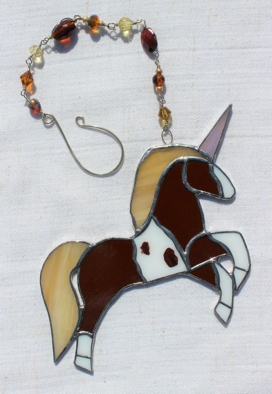 Brown and white horse unicorn with beaded chain