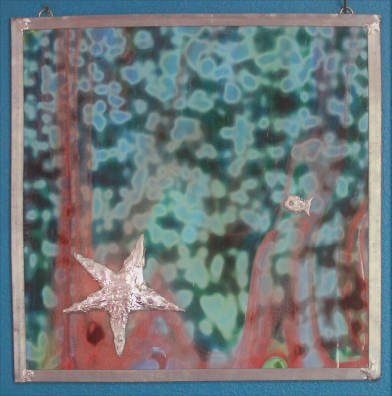 Decorative glass panel with starfish solder art