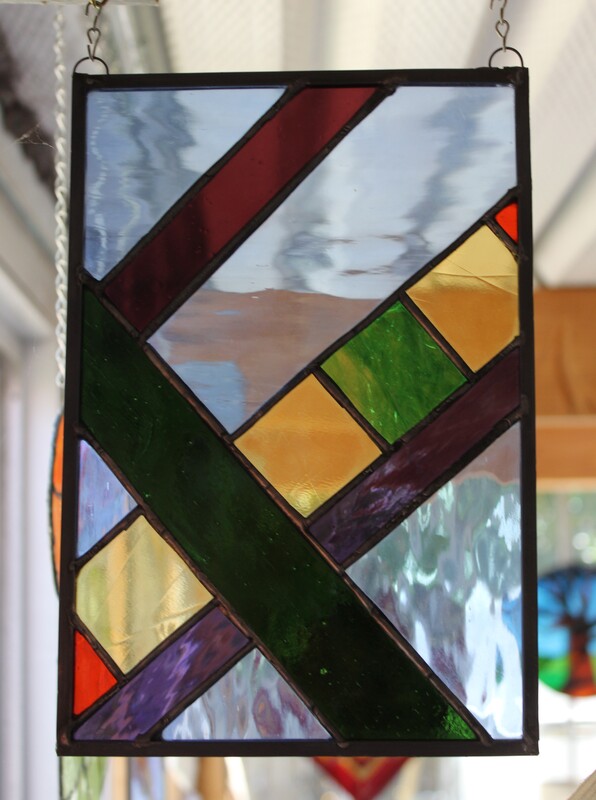 Abstract diagonal lines and squares, stained-glass panel 