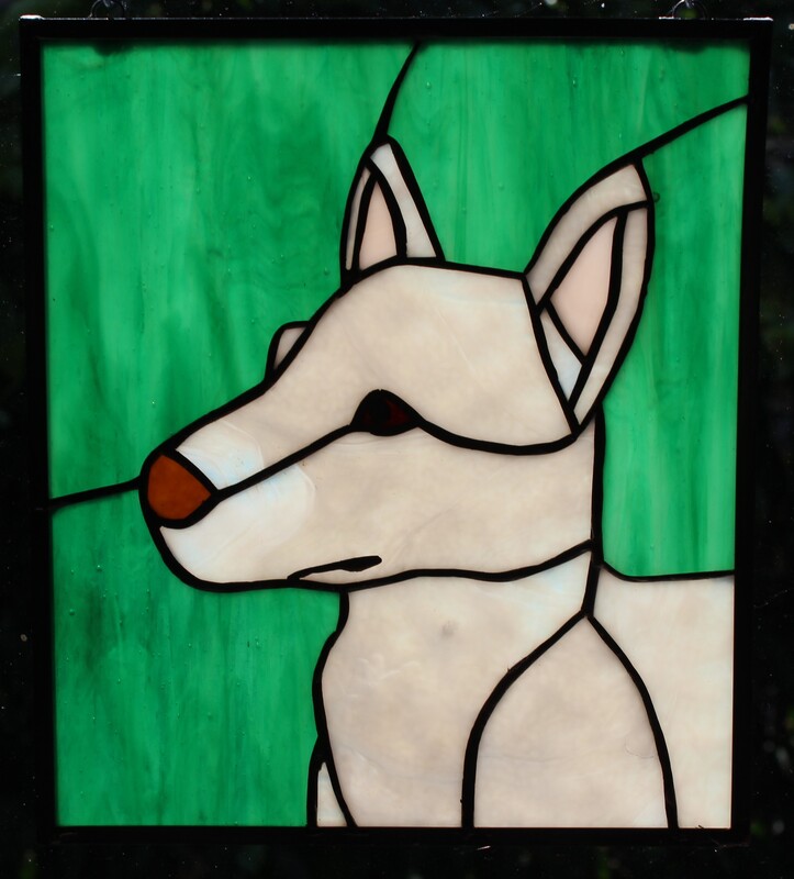 White dog with green background, stained-glass panel 